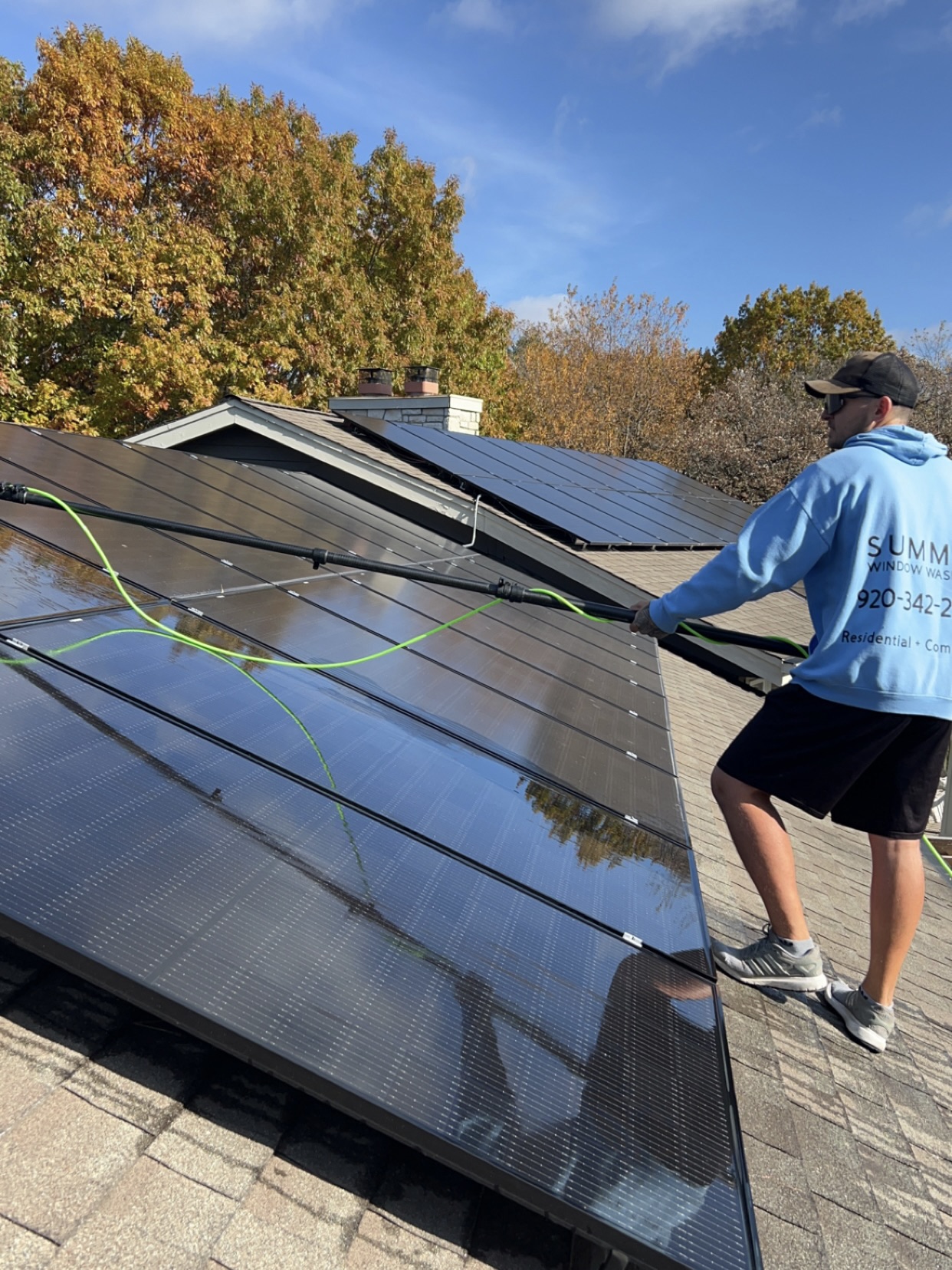 Summit Window Washing technician cleaning windows