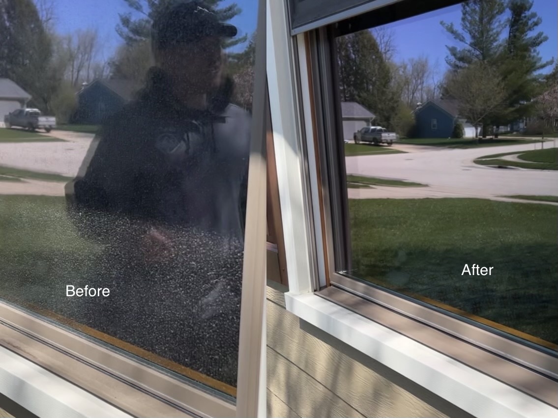 Summit Window Washing technician cleaning windows